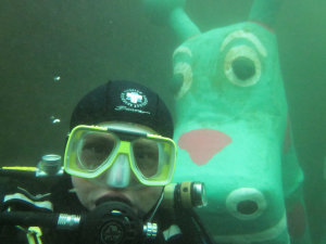 Diver and creature posing for the camera